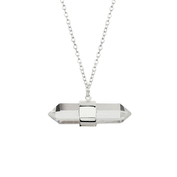 Close-up of ELVIE's Double Point Quartz Prism Necklace in 925 sterling silver. The necklace features a double-pointed clear quartz prism pendant on a fine chain, exuding a cool, effortlessly sexy, chic, and modern boho style.