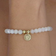 hand made bracelet made from natural moonstone beads and personalised with engraved pendant.