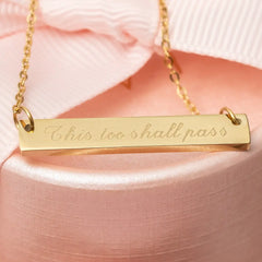 Gold engrave necklace engraved with the phrase "This too shall pass"