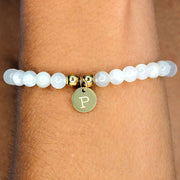hand made bracelet made from natural moonstone beads and personalised with engraved pendant.