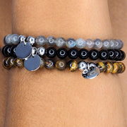Handmade bracelets made using labradorite, onyx, and tigers eye. Personalised with engraving of your choice.